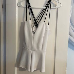 White peplum top with black strapped back